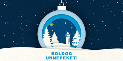 A grafikán egy karácsonyi díszgömb látható. A gömbön téli, esti környezetben hóval borított fenyők és a Fővárosi Vízművek jelképe, a víztorony kapott helyet. Felirat: Boldog ünnepeket!